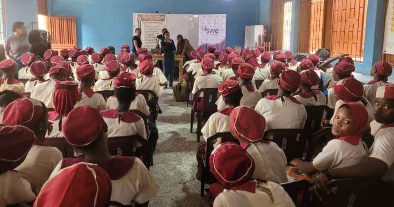 Photo of woman speaking to students at a SWE University of Lagos outreach event
