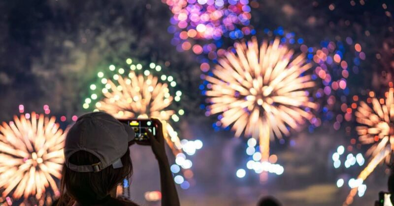 Pyrotechnics engineer watches fireworks in the sky