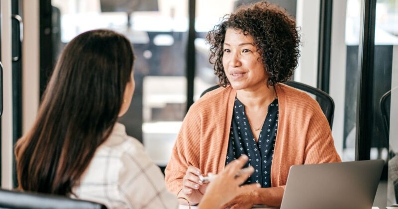 stock image of two women engineers mentoring in a work environment