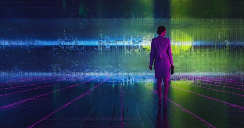 stock photo of woman engineer standing in front of technology